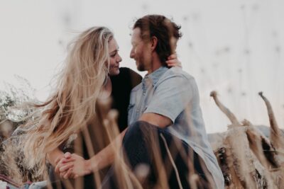 couple looking at each other while holding hands